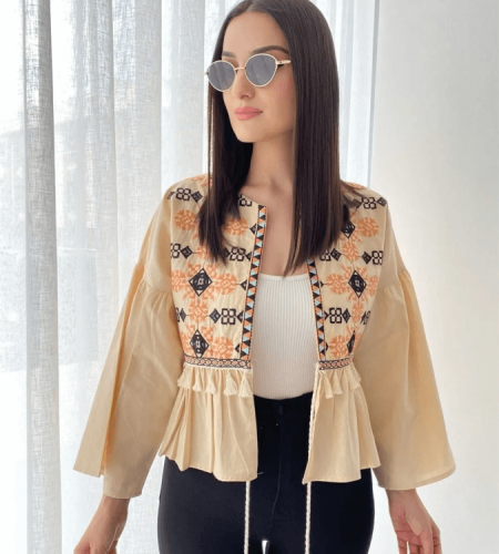 Patterned women's jacket decorated with tassels